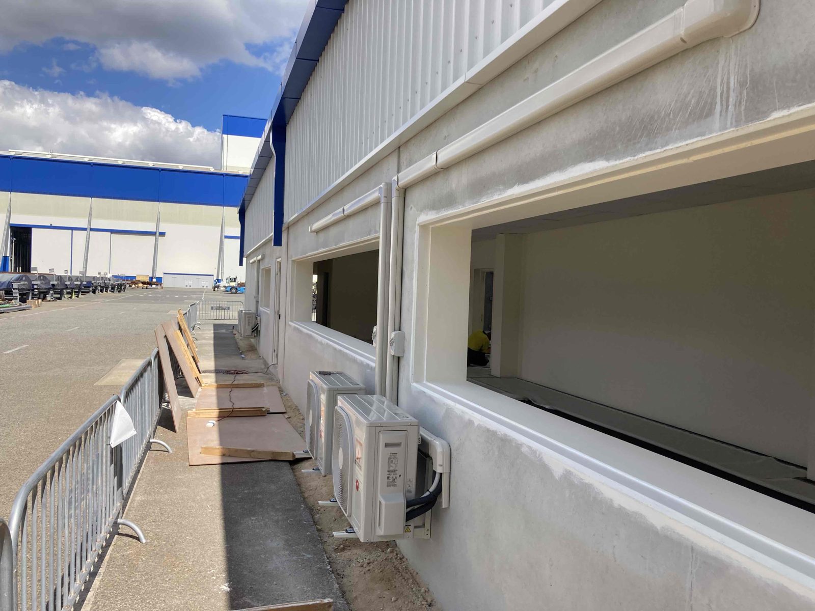 Split system outdoor units installed along the new store shed at Civmec, Nautical Drive, Henderson